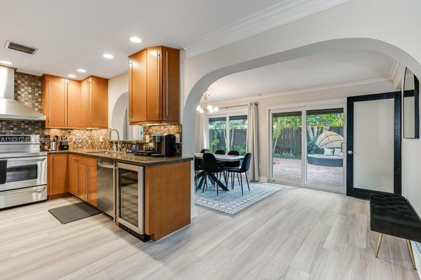 Dining room, Interior, Kitchen, Pendant Lights, Recessed Lighting, Stainless Steel Appliances, Wood Texture Flooring