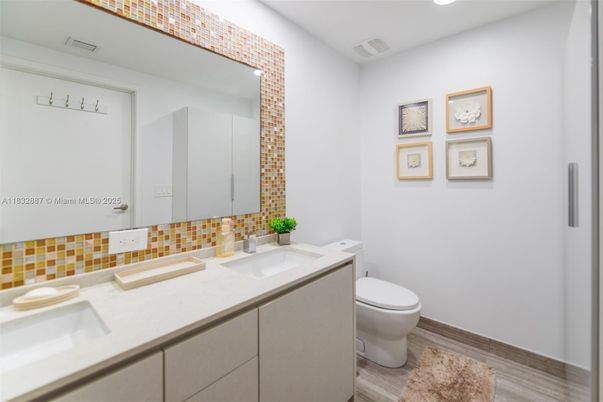 Bathroom, Dual Sink Vanities, Interior, Recessed Lighting, Wood Texture Flooring