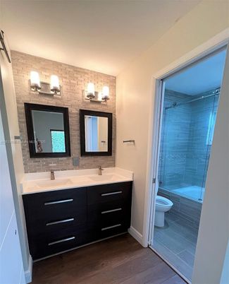 Bathroom, Dual Sink Vanities, Glass Shower, Interior, Wood Texture Flooring