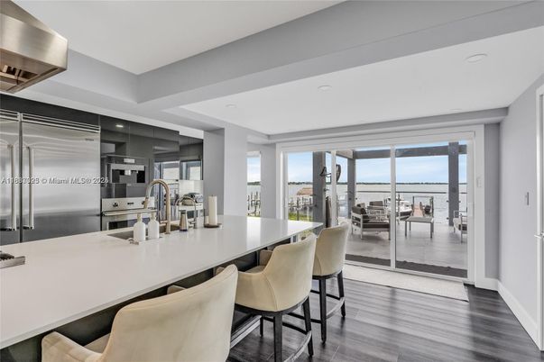 Dining room, Interior, Kitchen, Recessed Lighting, Stainless Steel Appliances, Water, Wood Texture Flooring