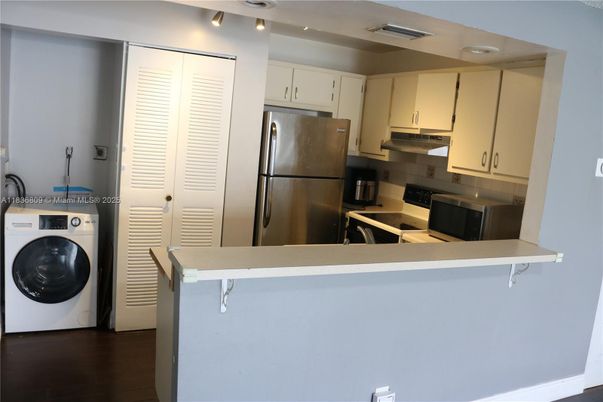 Interior, Kitchen, Recessed Lighting, Utility Closets, Washer, Wood Texture Flooring