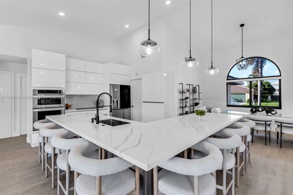 Dining room, Interior, Kitchen, Pendant Lights, Recessed Lighting, Stainless Steel Appliances, Wood Texture Flooring