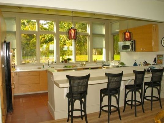 Interior, Kitchen, Wood Texture Flooring, Recessed Lighting, Stainless Steel Appliances, Ceramic Tile, Pendant Lights