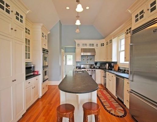 Interior, Kitchen, Wood Texture Flooring, Recessed Lighting, Stainless Steel Appliances, Pendant Lights