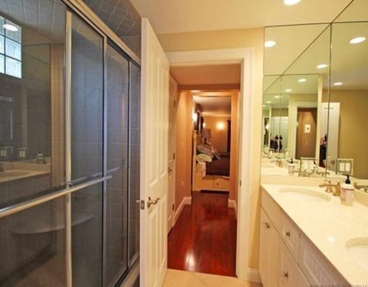 Interior, Bathroom, Wood Texture Flooring, Recessed Lighting, Glass Shower, Ceramic Tile, Dual Sink Vanities
