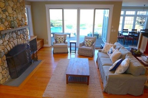 Interior, Wood Texture Flooring, Living room, Dining room, Fireplace, Chandelier, Water, Stone Walls, Pendant Lights