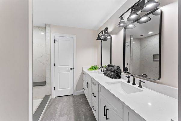 Bathroom, Dual Sink Vanities, Interior, Marble Walls, Recessed Lighting, Wood Texture Flooring