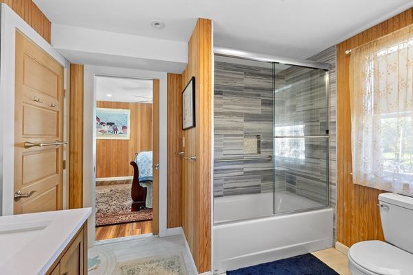 Bathroom, Glass Shower, Interior, Recessed Lighting, Wood Texture Flooring, Wooden Walls