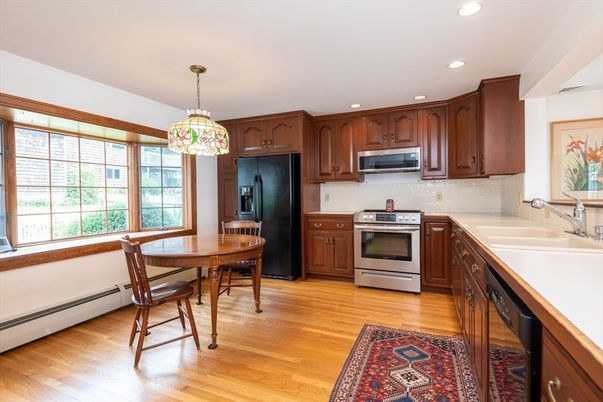 Dining room, Interior, Kitchen, Pendant Lights, Recessed Lighting, Stainless Steel Appliances, Wood Texture Flooring