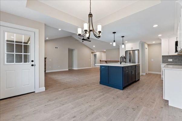 Chandelier, Interior, Kitchen, Pendant Lights, Recessed Lighting, Stainless Steel Appliances, Wood Texture Flooring