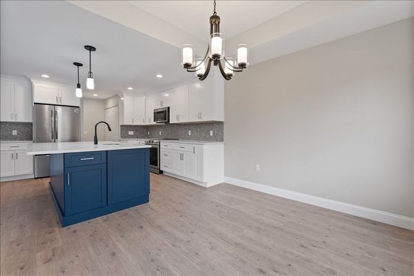Chandelier, Interior, Kitchen, Pendant Lights, Recessed Lighting, Stainless Steel Appliances, Wood Texture Flooring