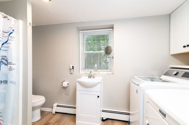 Bathroom, Interior, Recessed Lighting, Washer, Wood Texture Flooring