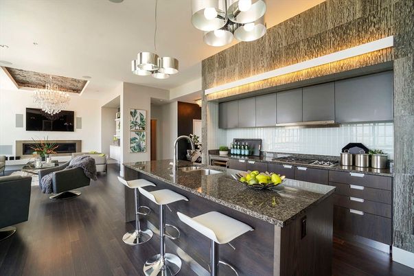 Chandelier, Dining room, Fireplace, Interior, Kitchen, Living room, Pendant Lights, Recessed Lighting, Stainless Steel Appliances, Wood Texture Flooring