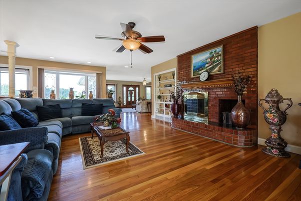 Fireplace, Interior, Living room, Recessed Lighting, Stone Walls, Wood Texture Flooring