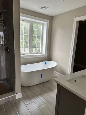 Bathroom, Free Standing Baths, Glass Shower, Interior, Wood Texture Flooring
