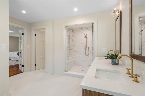Bathroom, Bedroom, Dual Sink Vanities, Glass Shower, Interior, Marble Walls, Recessed Lighting, Wood Texture Flooring