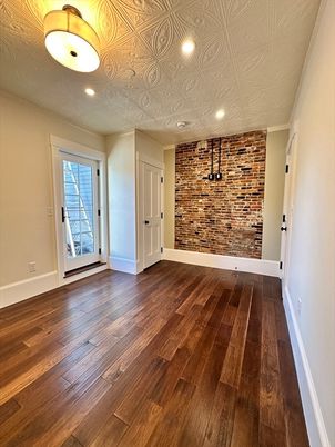 Empty room, Interior, Recessed Lighting, Stone Walls, Wood Texture Flooring