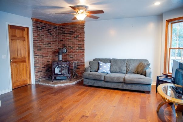 Fireplace, Interior, Recessed Lighting, Stone Walls, Wood Texture Flooring