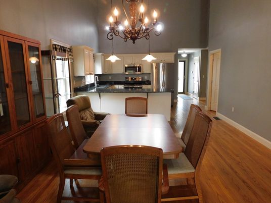 Chandelier, Dining room, Interior, Kitchen, Pendant Lights, Stainless Steel Appliances, Wood Texture Flooring