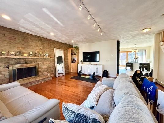 Fireplace, Interior, Living room, Pendant Lights, Recessed Lighting, Stone Walls, Wood Texture Flooring