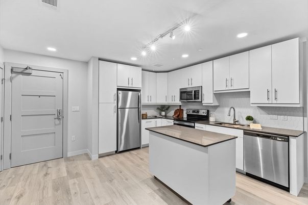 Interior, Kitchen, Recessed Lighting, Stainless Steel Appliances, Wood Texture Flooring