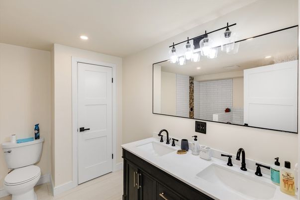 Bathroom, Dual Sink Vanities, Interior, Recessed Lighting, Wood Texture Flooring