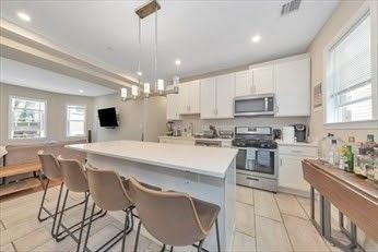 Chandelier, Interior, Kitchen, Pendant Lights, Recessed Lighting, Stainless Steel Appliances, Wood Texture Flooring