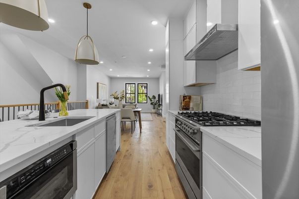 Dining room, Interior, Kitchen, Pendant Lights, Recessed Lighting, Stainless Steel Appliances, Wood Texture Flooring