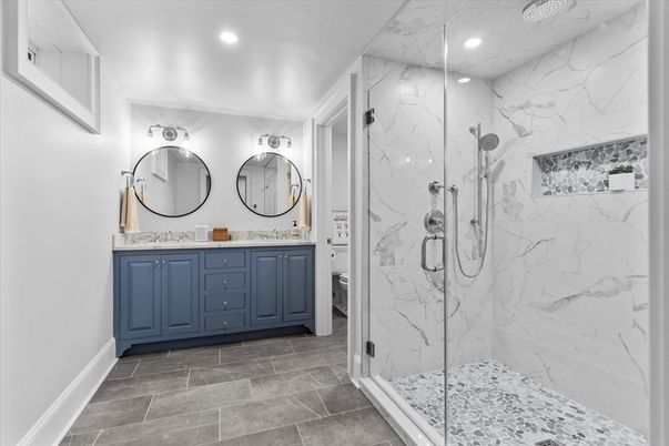 Bathroom, Dual Sink Vanities, Glass Shower, Interior, Marble Walls, Recessed Lighting