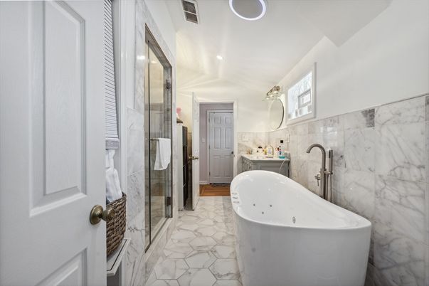 Bathroom, Free Standing Baths, Glass Shower, Interior, Marble, Marble Walls, Recessed Lighting