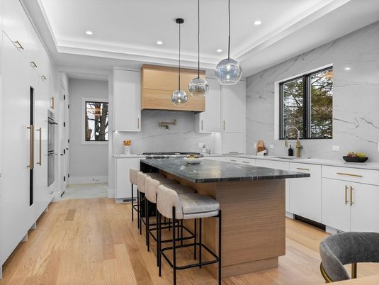Interior, Kitchen, Marble Walls, Pendant Lights, Recessed Lighting, Stainless Steel Appliances, Wood Texture Flooring