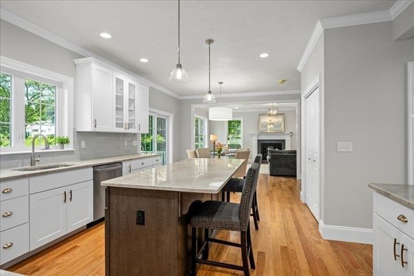 Dining room, Fireplace, Interior, Kitchen, Pendant Lights, Recessed Lighting, Stainless Steel Appliances, Wood Texture Flooring