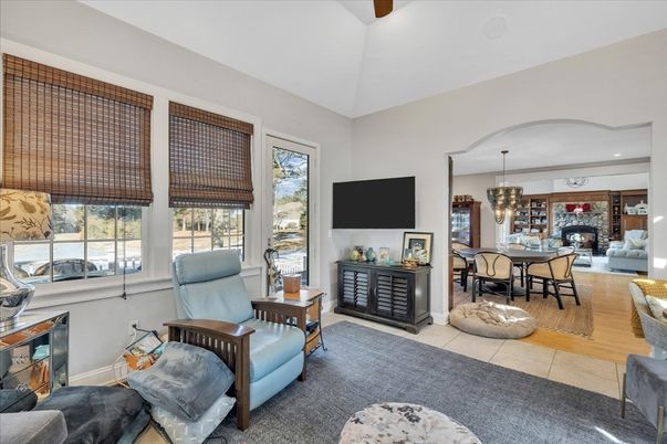 Chandelier, Dining room, Fireplace, Interior, Living room, Pendant Lights, Recessed Lighting, Wood Texture Flooring