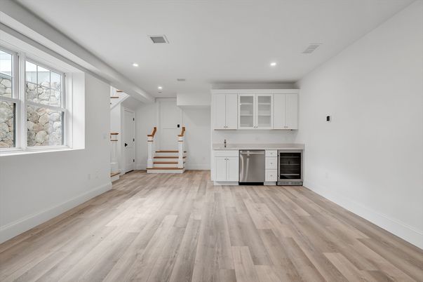 Empty room, Interior, Kitchen, Recessed Lighting, Stainless Steel Appliances, Wood Texture Flooring