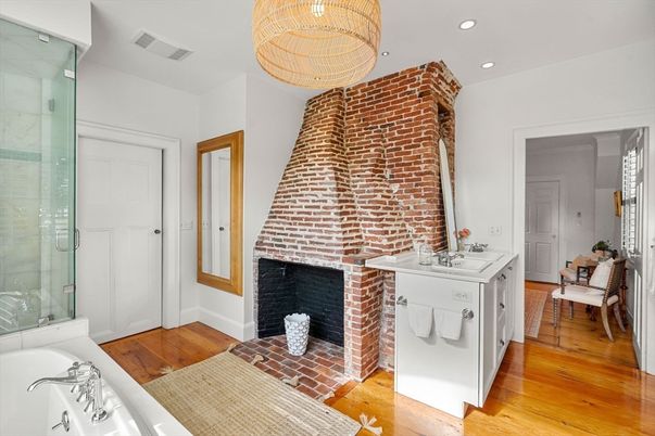Bathroom, Fireplace, Glass Shower, Interior, Recessed Lighting, Stone Walls, Wood Texture Flooring