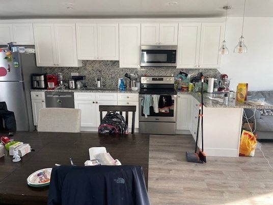 Dining room, Interior, Kitchen, Pendant Lights, Recessed Lighting, Stainless Steel Appliances, Wood Texture Flooring