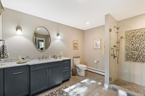 Bathroom, Dual Sink Vanities, Glass Shower, Interior, Recessed Lighting, Wood Texture Flooring
