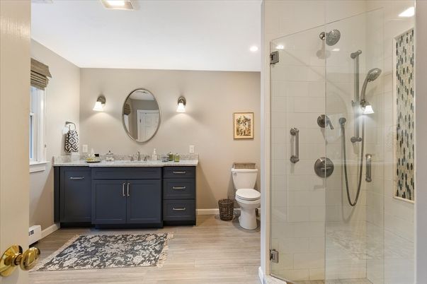 Bathroom, Dual Sink Vanities, Glass Shower, Interior, Recessed Lighting, Wood Texture Flooring
