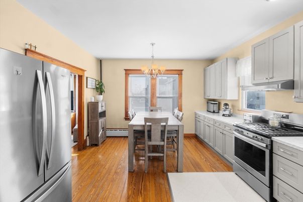 Chandelier, Dining room, Interior, Kitchen, Stainless Steel Appliances, Wood Texture Flooring