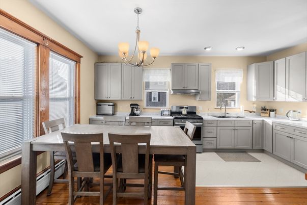 Chandelier, Dining room, Interior, Kitchen, Recessed Lighting, Stainless Steel Appliances, Wood Texture Flooring