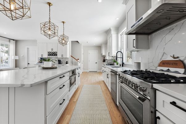 Interior, Kitchen, Marble Walls, Pendant Lights, Recessed Lighting, Stainless Steel Appliances, Wood Texture Flooring