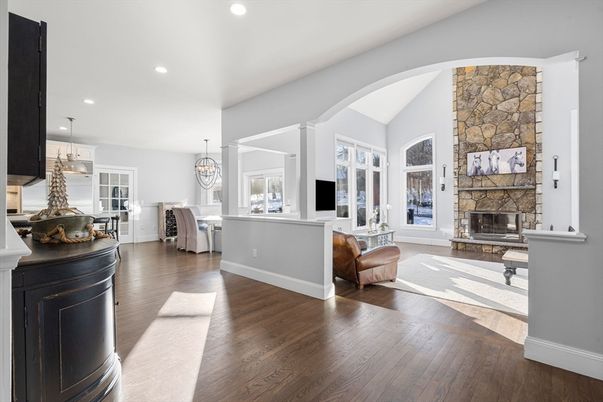Chandelier, Dining room, Fireplace, Interior, Pendant Lights, Recessed Lighting, Stone Walls, Wood Texture Flooring
