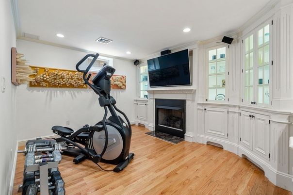 Fireplace, Fitness Equipment, Interior, Recessed Lighting, Wood Texture Flooring