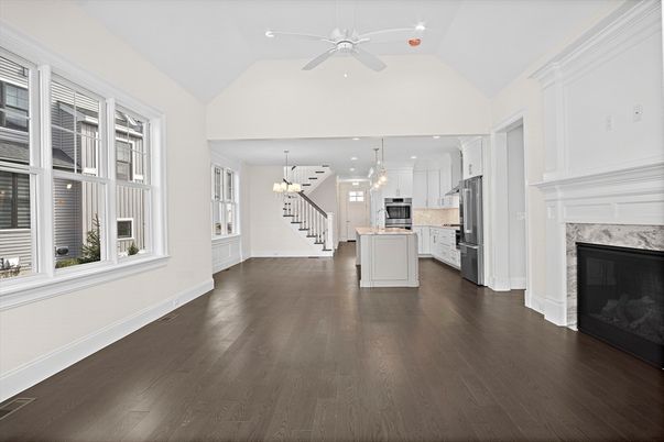 Chandelier, Fireplace, Interior, Kitchen, Pendant Lights, Recessed Lighting, Stainless Steel Appliances, Wood Texture Flooring