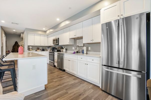 Dining room, Interior, Kitchen, Recessed Lighting, Stainless Steel Appliances, Wood Texture Flooring