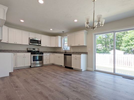 Chandelier, Interior, Kitchen, Pendant Lights, Recessed Lighting, Stainless Steel Appliances, Wood Texture Flooring