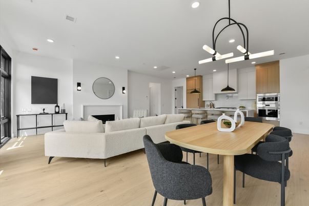 Dining room, Fireplace, Interior, Kitchen, Living room, Pendant Lights, Recessed Lighting, Stainless Steel Appliances, Wood Texture Flooring