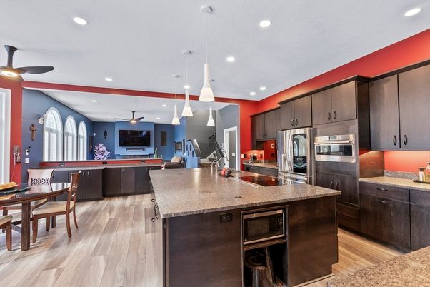 Dining room, Interior, Kitchen, Pendant Lights, Recessed Lighting, Stainless Steel Appliances, Wood Texture Flooring