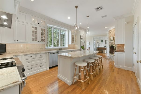 Fireplace, Interior, Kitchen, Pendant Lights, Recessed Lighting, Stainless Steel Appliances, Stone Walls, Wood Texture Flooring