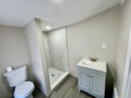 Bathroom, Interior, Marble Walls, Recessed Lighting, Wood Texture Flooring